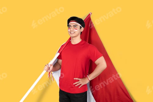 Preview: Indonesian man holding red and white flag as his country's flag