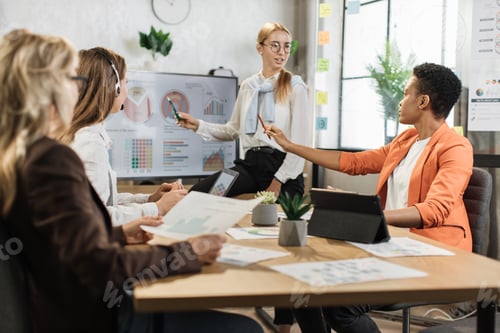 Preview: Caucasian blond woman in white shirt and eyeglasses showing financial statistic of enterprise