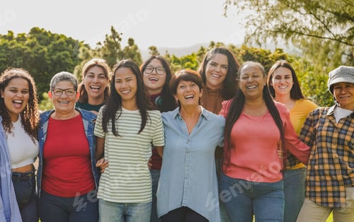 Preview: Group of multiracial women hugging each other at city park - Female community with different ages