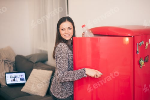 Preview: Beautiful One Young Woman, Opening Fridge In Her Apartment.
