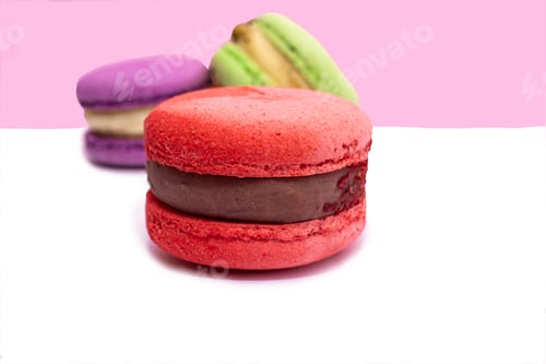 Preview: Sweet colorful macarons isolated on white background. Tasty red, green, brown, violet macaroons.