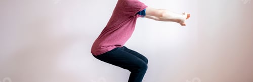 Preview: cropped male body chest and leg doing squats in the gym