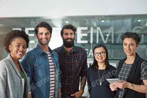 Preview: Cropped portrait of a group of creative businesspeople standing in their office
