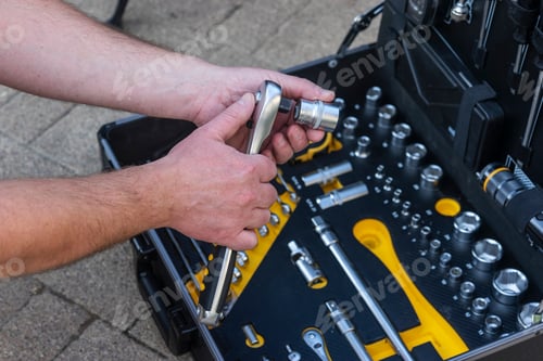 Preview: A technician man inspecting the case with the instuments