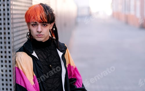 Preview: Portrait of young guy with painted hair.