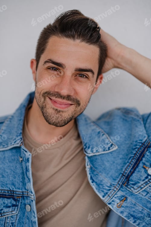 Preview: Portrait of young caucasian man on white background, looking at camera.