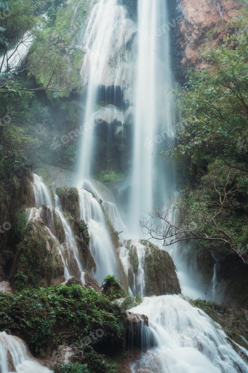 Preview: Erawan waterfall 7th floor with water flowing in tropical rainforest at national park