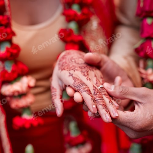 Preview: Cropped shot of a hindu couple exchanging rings on their wedding day