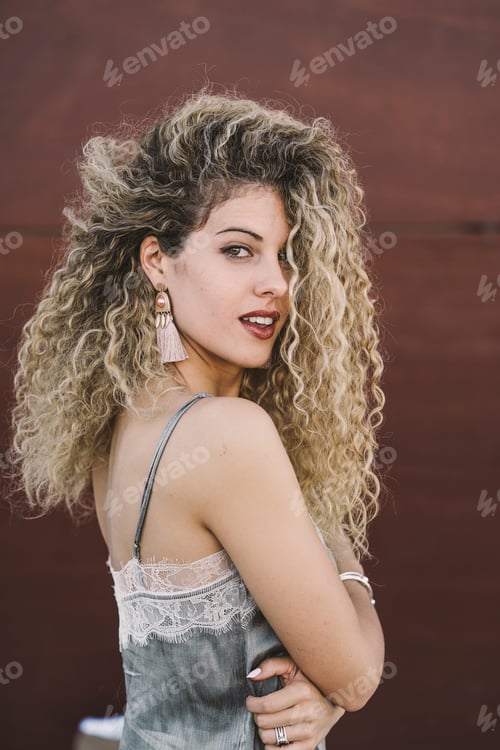 Preview: Portrait of fashionable young woman with dyed blond ringlets