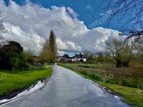 Preview: a country road with snow falling on the ground and trees, Kale
