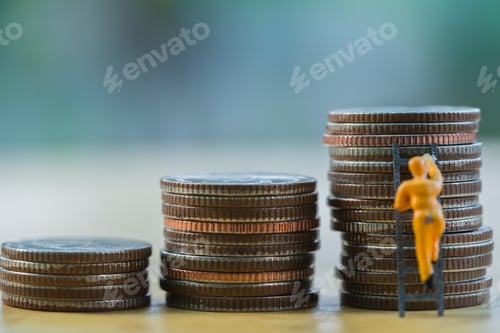 Preview: Close up miniature back businessman standing look up money stack coin