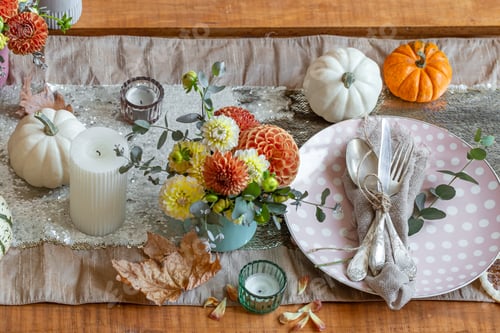 Preview: Festive table setting with pumpkins, candles and chrysanthemum flowers.
