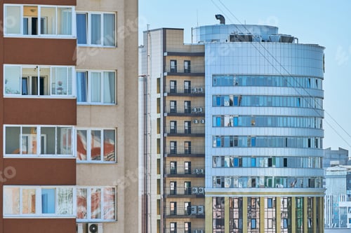 Preview: Facade of multistorey building with new modern apartments