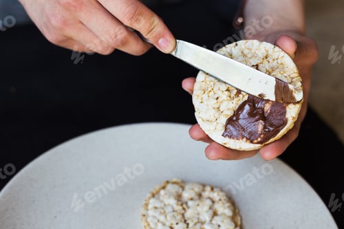 Spreading Chocolate Hazelnut Spread on Rice Cake