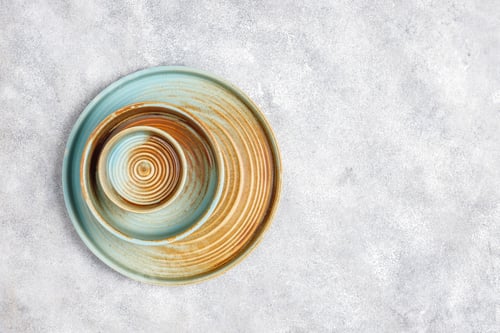 Preview: Different ceramic empty plates and bowls.