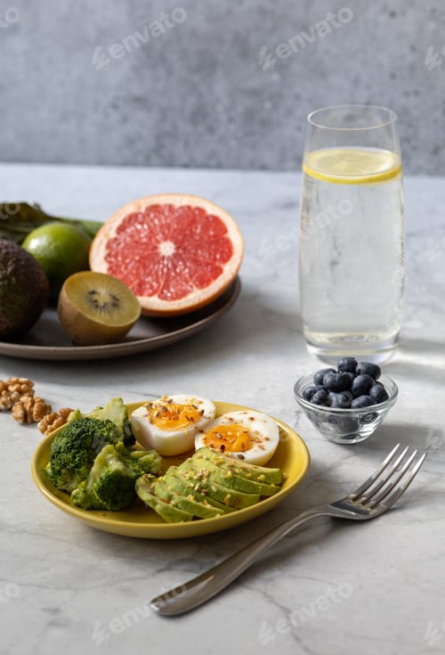 Preview: Healthy breakfast to improve metabolism with boiled eggs, vegetables, fruits, seeds and nuts.
