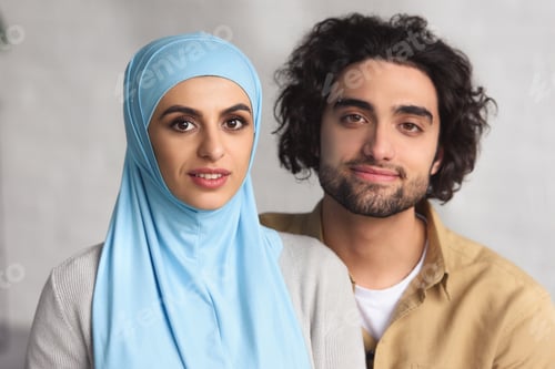 Preview: portrait of muslim couple looking at camera at home