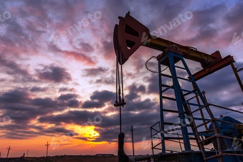 Preview: Oil rig pump against a colorful sunset sky