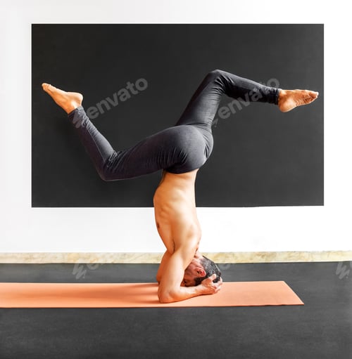 Preview: Man doing a sirsasana variation yoga headstand