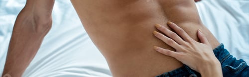 Preview: panoramic shot of woman touching man in bedroom