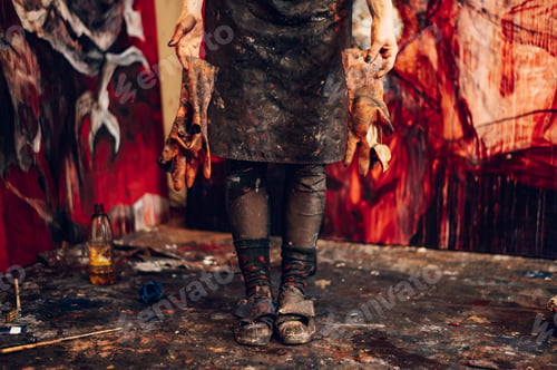 Preview: Young redhead woman painter standing by her art masterpiece on a big canvas