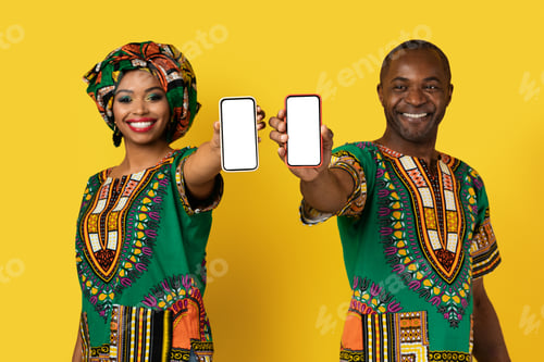 Preview: Cheery african man and woman showing cell phones with mockup