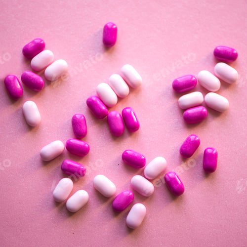 Preview: Pile of pink and white drugs in the shape of a heart on a pink background