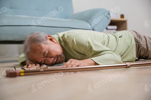 Preview: Sick senior old man falling down lying on the ground because stumbled at home