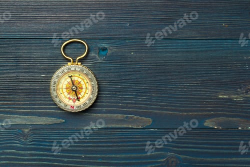Preview: compass on wooden background