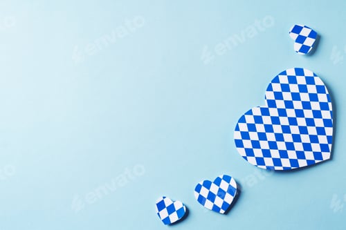 Preview: Oktoberfest backdrop with blue traditional print hearts on blue background