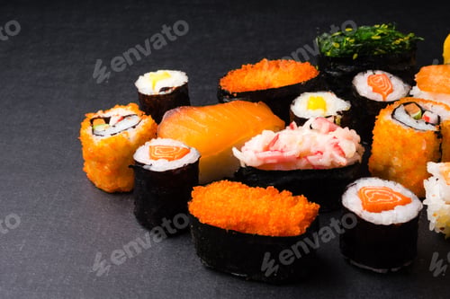 Preview: Sushi set on black background, Japanese food.