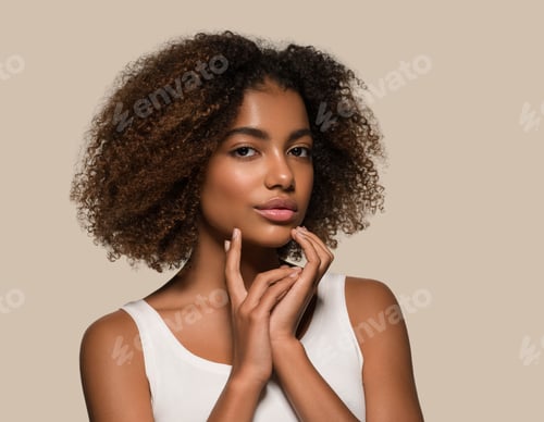 Preview: Beautiful african woman white t-shirt portrait afro haircut touching her face Color background brown
