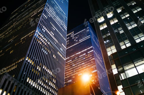 Preview: Modern skyscrapers on dark night street