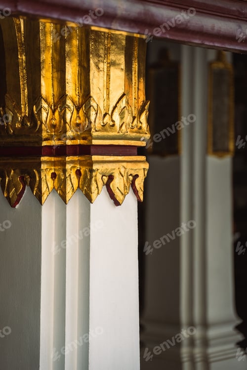Preview: Vertical closeup shot of a golden pillar in a Thai temple.