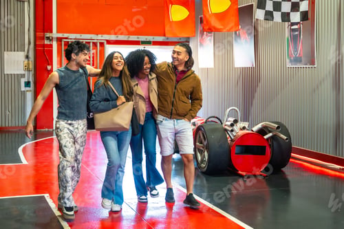 Preview: Diverse young adult friends enjoying karting entertainment activity