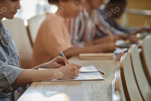 Preview: Schoolgirl making notes at lecture