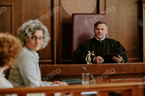 Preview: Caucasian Middle Aged Male Judge Listening to Lawyers during Courtroom Trial