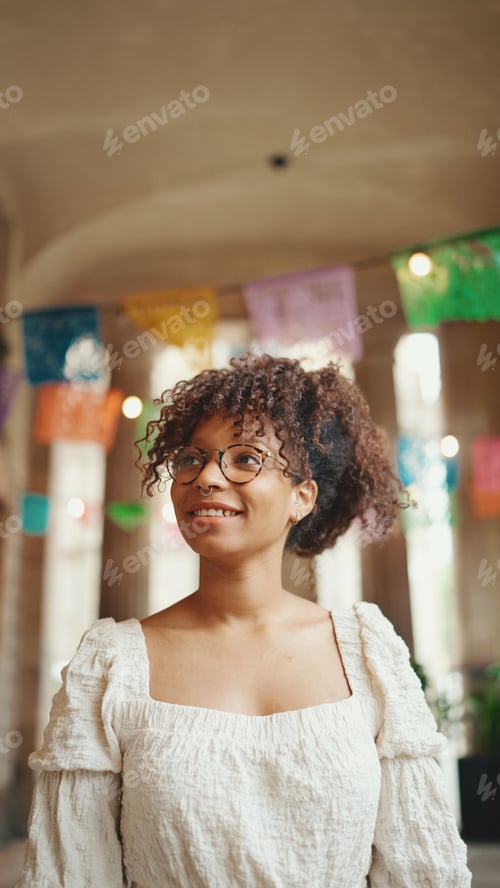 Preview: Closeup portrait of a young woman in glasses smiling posing on smartphone selfie camera.