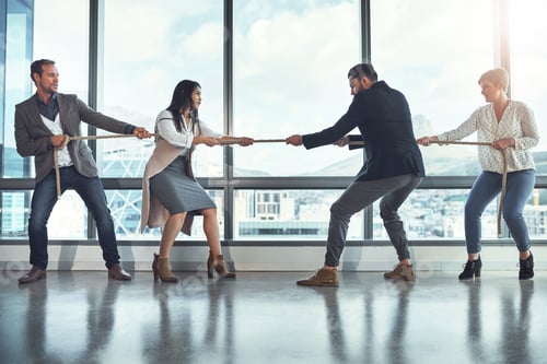 Preview: Shot of a group of businesspeople pulling on a rope during tug of war in an office
