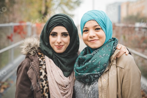 Preview: Portrait of two young female friends on park path