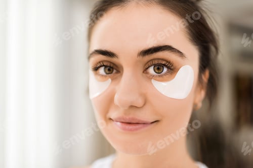 Preview: A young caucasian woman with patches under her eyes looking into the camera