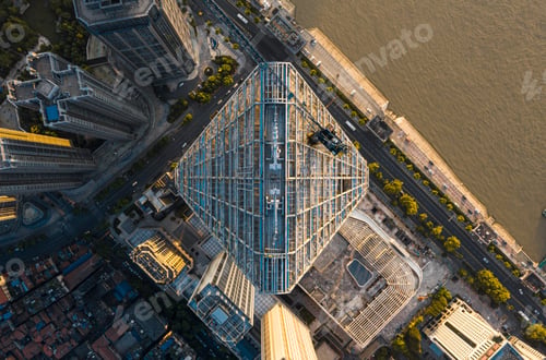 Preview: View of A skyscraper decorated with glass curtain walls by the Yangtze River