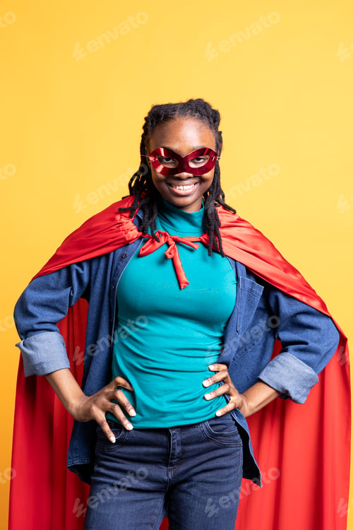 Preview: Portrait of woman dressed as comic book hero hiding identity, standing proud