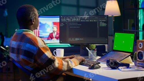 Preview: Black web developer handling database servers for safety with green screen