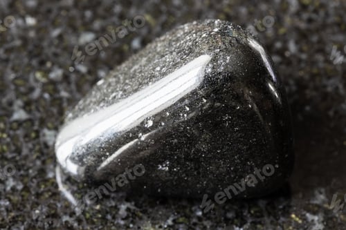 Preview: tumbled schorl black tourmaline mineral on black
