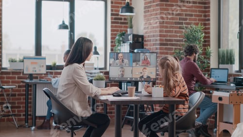 Preview: Single mom with child at work attending video call meeting on computer