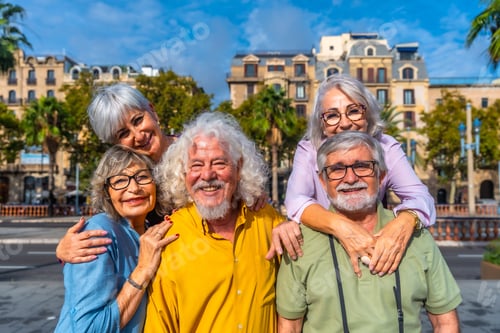 Preview: Happy senior friends smiling during city vacation travel