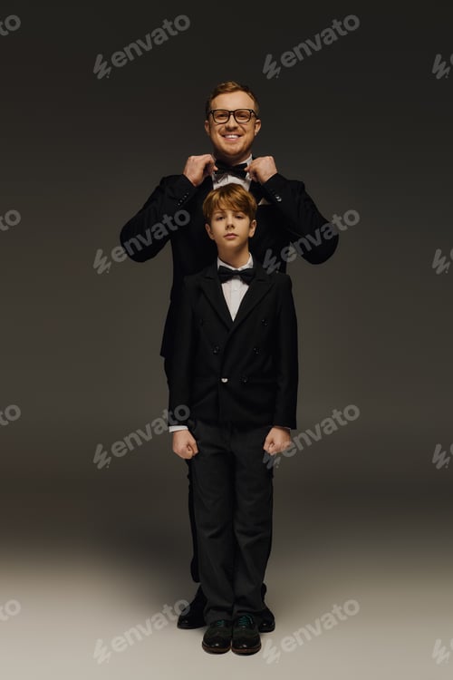 Preview: Elegant father and son share special moment in stylish bow ties at the studio
