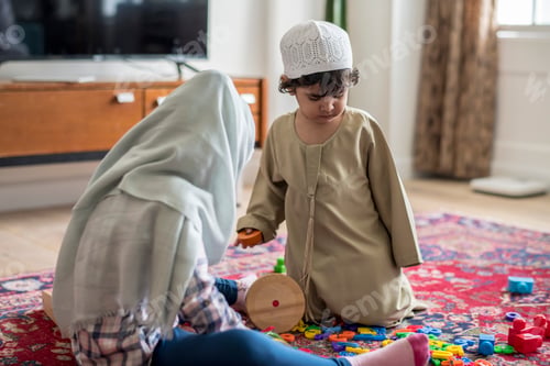 Preview: Muslim family relaxing and playing at home