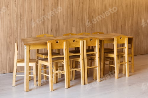 Preview: wooden table and small chairs in kindergarten room